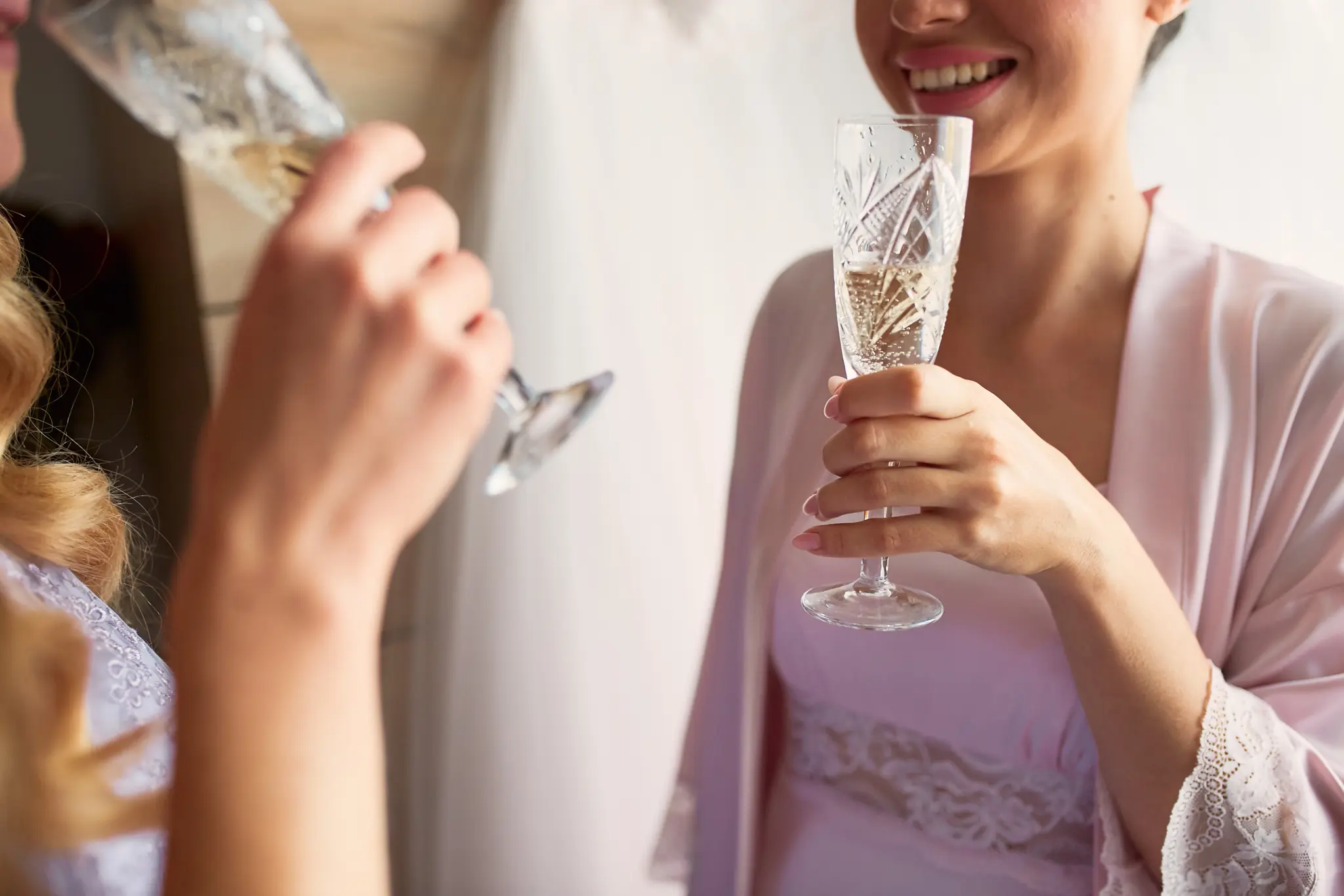bride bridesmaids drink champagne preparing morning